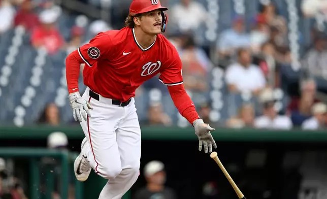 Washington Nationals Brady House hits a double during the second inning of a baseball game against the Arizona Diamondbacks, Sunday, July 26, 2026, in Washington. (AP Photo/John McDonnell)