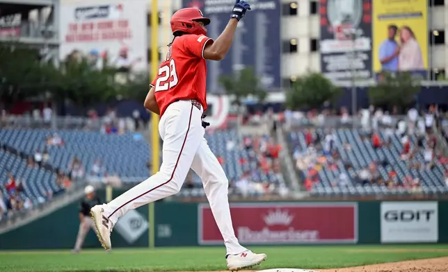 Washington Nationals' James Wood runs around the bases after hitting a solo home run during the eighth inning of a baseball game against the Arizona Diamondbacks, Sunday, July 26, 2026, in Washington. (AP Photo/John McDonnell)