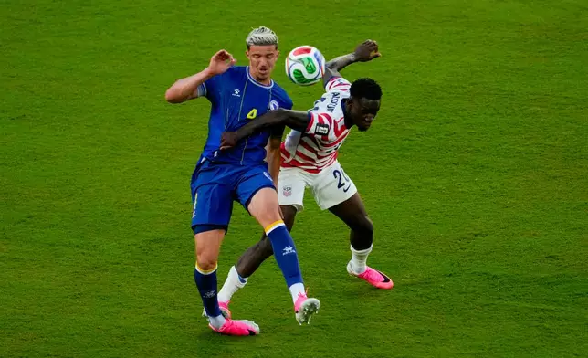 United States' Folarin Balogun (20) fouls Bosnia's Tarik Muharemovic (4) during the World Cup round of 32 soccer match between the United States and Bosnia in Santa Clara, Calif., near San Francisco, Wednesday, July 1, 2026. Balogun received a red card on the play. (AP Photo/Jeff Chiu)