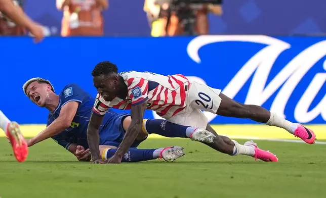 Bosnia's Tarik Muharemovic (4) reacts after a tackle form United States' Folarin Balogun (20) during the World Cup round of 32 soccer match between the United States and Bosnia in Santa Clara, Calif., near San Francisco, Wednesday, July 1, 2026. (AP Photo/Julio Cortez)