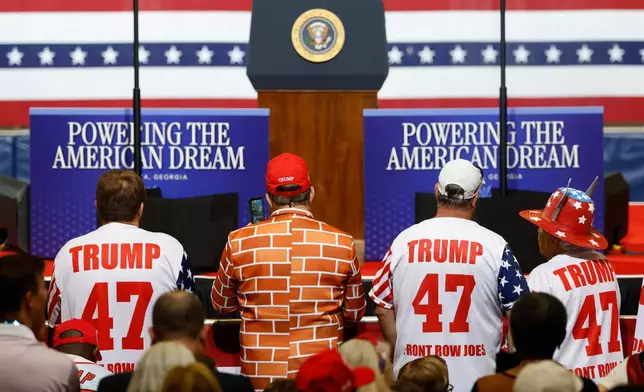 Supporters stand ready for President Donald Trump to arrive to speak at Wheeler High School in Marietta, Ga., Wednesday, July 22, 2026. (AP Photo/Erik S. Lesser)