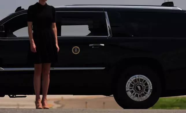 President Donald Trump departs a dignified transfer while Natalie Harp stands outside the vehicle, Wednesday, July 22, 2026, at Dover Air Force Base, Del. (AP Photo/Julia Demaree Nikhinson)