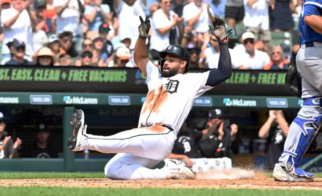 Detroit Tigers' Riley Greene slides and scores during the fifth inning of a baseball game against the Kansas City Royals, Sunday, July 26, 2026, in Detroit. (AP Photo/Jose Juarez)