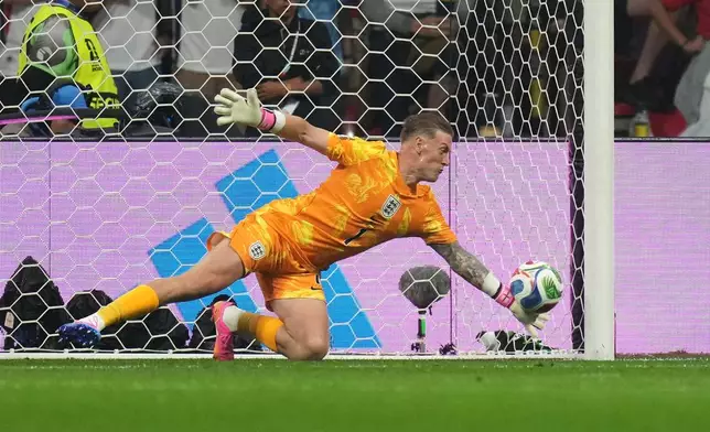 England goalkeeper Jordan Pickford saves a shot from Mexico's Raul Jimenez during the World Cup round of 16 soccer match between Mexico and England in Mexico City, Sunday, July 5, 2026. (AP Photo/Silvia Izquierdo)