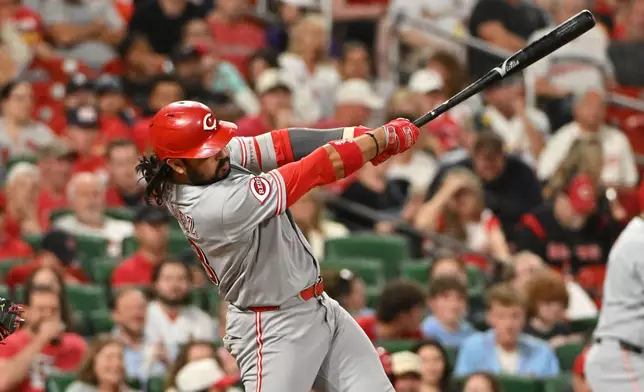 Cincinnati Reds' Eugenio Suárez hits a 2-run home run against the St. Louis Cardinals during the seventh inning of a baseball game, Friday, July 24, 2026, in St. Louis. (AP Photo/Jeff Le)