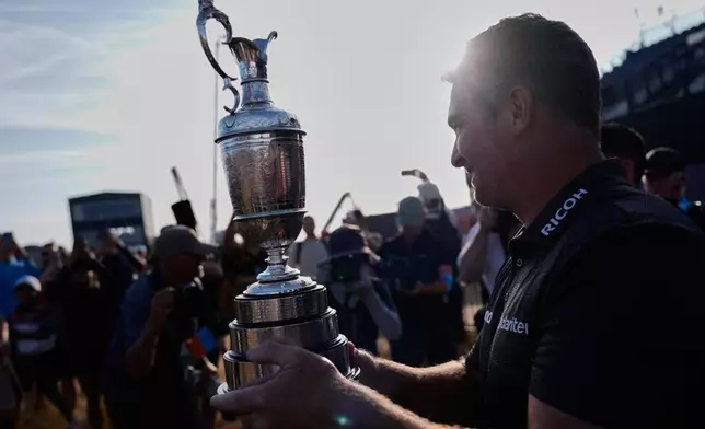 Ryan Fox of New Zealand poses with the Claret Jug trophy after winning the British Open Golf championships at Royal Birkdale golf club, in Southport, England, Sunday, July 19, 2026. (AP Photo/David Goldman)