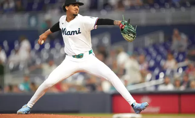 Miami Marlins starting pitcher Eury Pérez throws during the first inning of a baseball game against the Cleveland Guardians, Saturday, July 11, 2026, in Miami. (AP Photo/Jim Rassol)