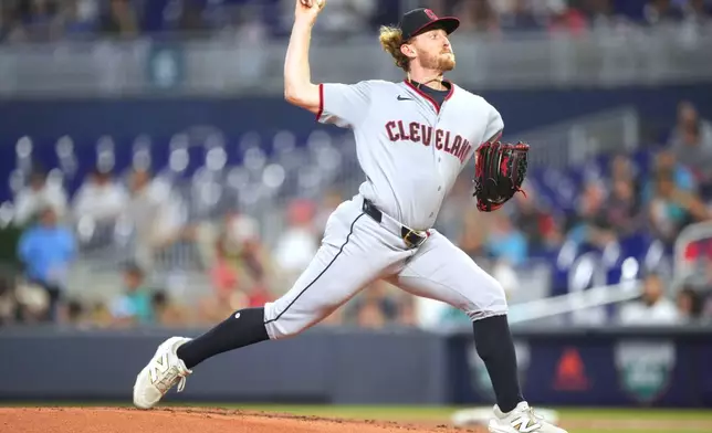 Cleveland Guardians starting pitcher Tanner Bibee throws during the first inning of a baseball game against the Miami Marlins, Saturday, July 11, 2026, in Miami. (AP Photo/Jim Rassol)