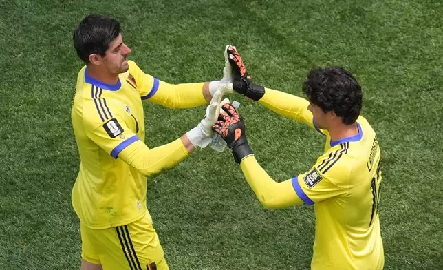 Belgium goalkeeper Thibaut Courtois (1) is substitued by Belgium goalkeeper Senne Lammens (12) due to an injury during the World Cup quarterfinal soccer match between Spain and Belgium in Inglewood, Calif., near Los Angeles, Friday, July 10, 2026. (AP Photo/Marcio J. Sanchez)