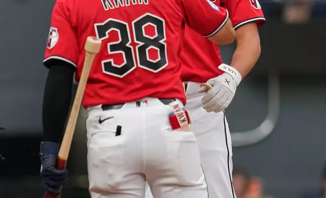 Cleveland Guardians' Petey Halpin, right, celebrates his fourth inning home run with Steven Kwan (38) in a baseball game against the Minnesota Twins in Cleveland, Monday, July 20, 2026. (AP Photo/Sue Ogrocki)