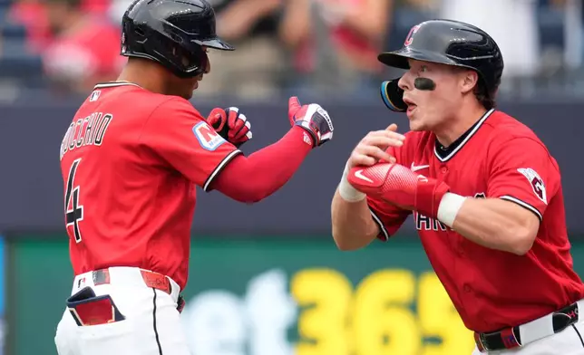 Cleveland Guardians' Brayan Rocchio (4) celebrates with Travis Bazzana, right, after hitting a two-run home run in the first inning of a baseball game against the Minnesota Twins in Cleveland, Monday, July 20, 2026. (AP Photo/Sue Ogrocki)