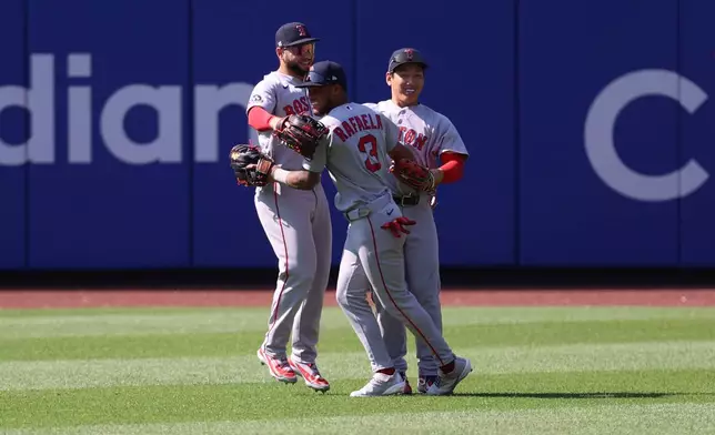 From left to right, Boston Red Sox's Wilyer Abreu, Ceddanne Rafaela and Masataka Yoshida react after defeating the New York Mets in a baseball game Sunday, July 12, 2026, in New York. (AP Photo/Pamela Smith)