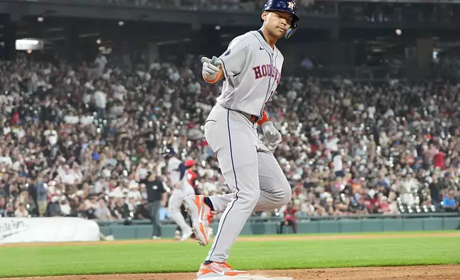 Houston Astros' Cam Smith runs the bases after hitting a two-run homer against the Chicago White Sox during the sixth inning of a baseball game Friday, July 24, 2026, in Chicago. (AP Photo/David Banks)