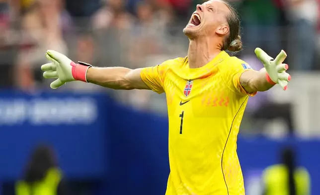 Norway goalkeeper Oerjan Nyland (1) reacts after Erling Haaland (9) scored his side's second goal during the World Cup round of 32 soccer match between Ivory Coast and Norway in Arlington, Texas, near Dallas, Tuesday, June 30, 2026. (AP Photo/Julio Cortez)