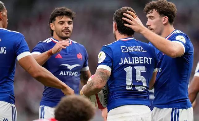 Teammates celebrate a try by France's Matthieu Jalibert, second from right, during a Nations Championship rugby match between Japan and France in Tokyo, Saturday, July 18, 2026. (AP Photo/Shuji Kajiyama)