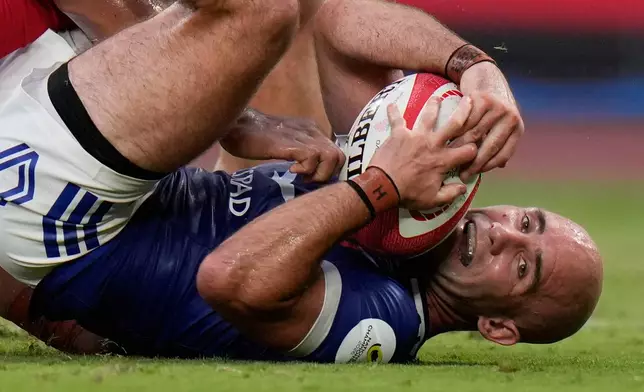 France's Maxime Lucu scores a try during a Nations Championship rugby match between Japan and France in Tokyo, Saturday, July 18, 2026. (AP Photo/Shuji Kajiyama)
