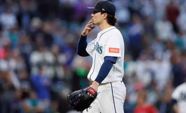 Seattle Mariners pitcher Bryan Woo reacts after being relieved in the sixth inning of a baseball game against the Los Angeles Angels, Tuesday, June 30, 2026, in Seattle. (AP Photo/Kevin Ng)