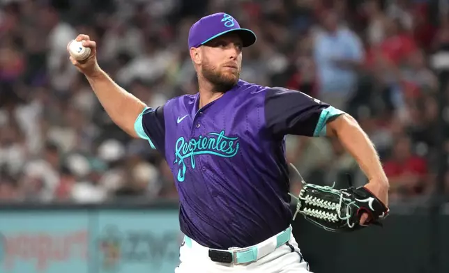 Arizona Diamondbacks pitcher Merrill Kelly throws against the St. Louis Cardinals in the first inning of a baseball game, Friday, July 17, 2026, in Phoenix. (AP Photo/Rick Scuteri)