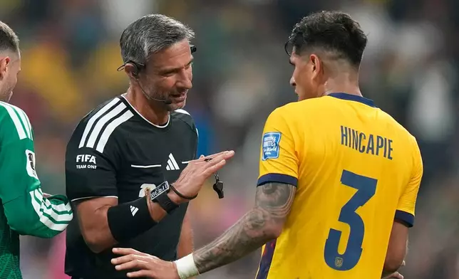Referee Slavko Vincic, of Slovenia, talks to Ecuador's Piero Hincapie (3) during the World Cup round of 32 soccer match between Mexico and Ecuador in Mexico City, Tuesday, June 30, 2026. (AP Photo/Fernando Llano)