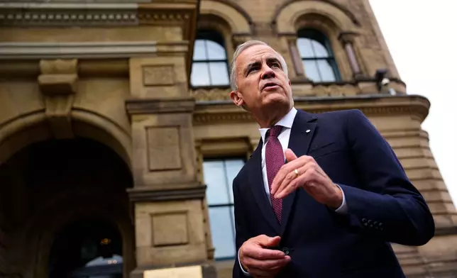 Canada Prime Minister Mark Carney makes a statement outside the Office of the Prime Minister and Privy Council in Ottawa, on Tuesday, July 21, 2026.(Justin Tang/The Canadian Press via AP)
