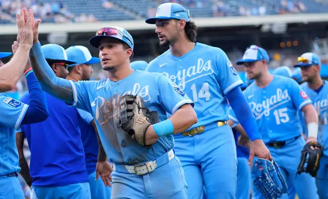 Kansas City Royals' Isaac Collins celebrates with teammates after their baseball game against the San Diego Padres, Saturday, July 18, 2026, in Kansas City, Mo. (AP Photo/Charlie Riedel)