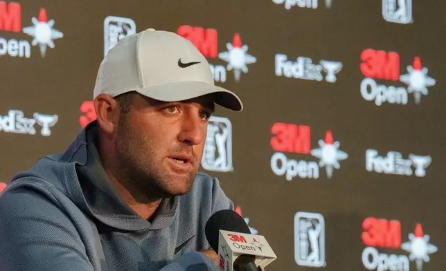 Scottie Scheffler speaks at a news conference after a practice round at the 3M Open golf tournament, Wednesday, July 22, 2026, in Blaine, Minn. (Justin Enriquez/Minnesota Star Tribune via AP)