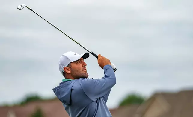 Scottie Scheffler watches a shot during a practice round at the 3M Open golf tournament, Wednesday, July 22, 2026, in Blaine, Minn. (Justin Enriquez/Minnesota Star Tribune via AP)