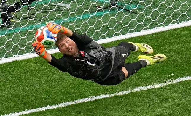 Switzerland goalkeeper Gregor Kobel (1) blocks a penalty shot by Colombia's Cucho Hernandez in a shootout during the World Cup round of 16 soccer match in Vancouver, British Columbia, Tuesday, July 7, 2026. (AP Photo/Gregory Bull)