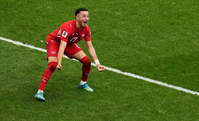 Switzerland's Ruben Vargas (17) celebrates after making the winning kick in a penalty shootout during the World Cup round of 16 soccer match between Switzerland and Colombia in Vancouver, British Columbia, Tuesday, July 7, 2026. (AP Photo/Gregory Bull)