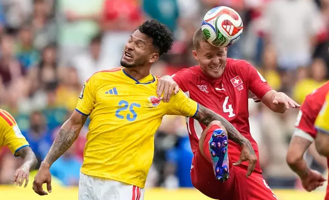 Colombia's Luis Suárez, left, and Switzerland's Nico Elvedi battle for the ball during the World Cup round of 16 soccer match between Switzerland and Colombia in Vancouver, British Columbia, Tuesday, July 7, 2026. (AP Photo/Lindsey Wasson)