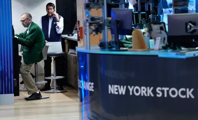 Traders work on the floor at the New York Stock Exchange in New York, Monday, July 6, 2026. (AP Photo/Seth Wenig)