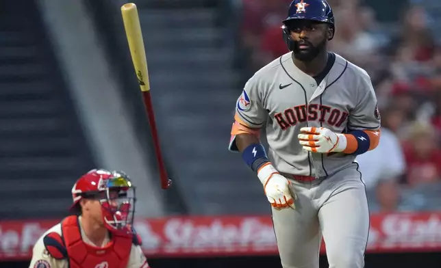 Houston Astros' Taylor Trammell, right, tosses his bat after hitting a home run against the Los Angeles Angels during the fourth inning of a baseball game Monday, July 27, 2026, in Anaheim, Calif. (AP Photo/Scott Strazzante)