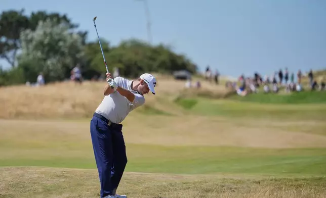 Rasmus Hojgaard of Denmark prepares to play a shot on the 10th fairway during a practice round for the British Open Golf championships at Royal Birkdale golf club, in Southport, England, Tuesday, July 14, 2026. (AP Photo/Jon Super)