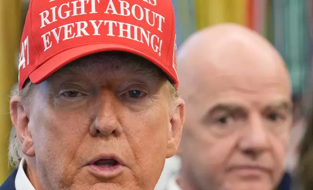 FILE - President Donald Trump speaks as FIFA President Gianni Infantino listens in the Oval Office of the White House, Friday, Aug. 22, 2025, in Washington. (AP Photo/Jacquelyn Martin, File)