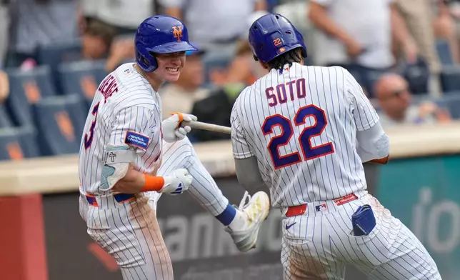 New York Mets' Juan Soto, right, celebrates his solo home run with Carson Benge during the seventh inning of a baseball game against the Kansas City Royals, Thursday, July 9, 2026, in New York. (AP Photo/Seth Wenig)