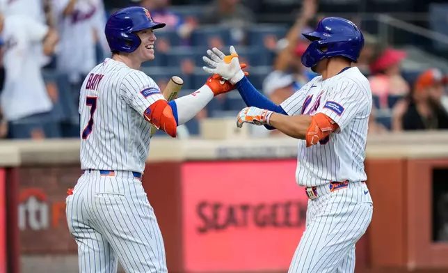 New York Mets' Tyrone Taylor, right, celebrates his solo home run with Brett Baty during the fifth inning of a baseball game against the Kansas City Royals, Thursday, July 9, 2026, in New York. (AP Photo/Seth Wenig)