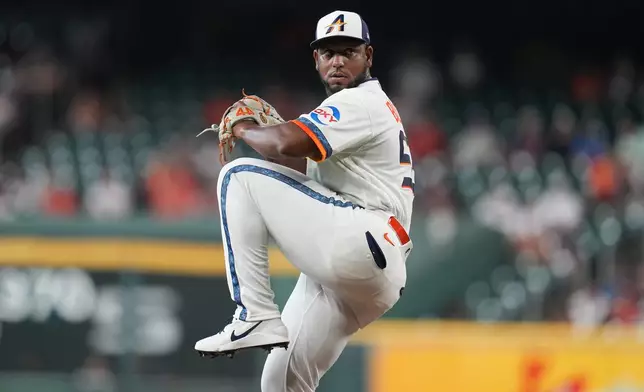 Houston Astros starting pitcher Ronel Blanco winds up to deliver to Miami Marlins' Kyle Stowers during the first inning of a baseball game, Monday, July 20, 2026, in Houston. (AP Photo/Karen Warren)