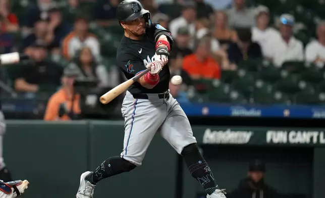 Miami Marlins' Heriberto Hernandez hits an RBI single off Houston Astros relief pitcher Josh Hader during the ninth inning of a baseball game, Monday, July 20, 2026, in Houston. (AP Photo/Karen Warren)