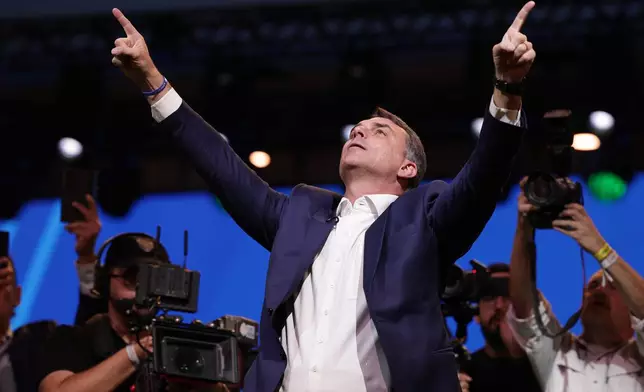 Brazilian Sen. Flavio Bolsonaro, the son of former President Jair Bolsonaro, arrives to the Liberal Party convention where he was confirmed as the party's presidential candidate, in Sao Paulo, Saturday, July 25, 2026. (AP Photo/Ettore Chiereguini)