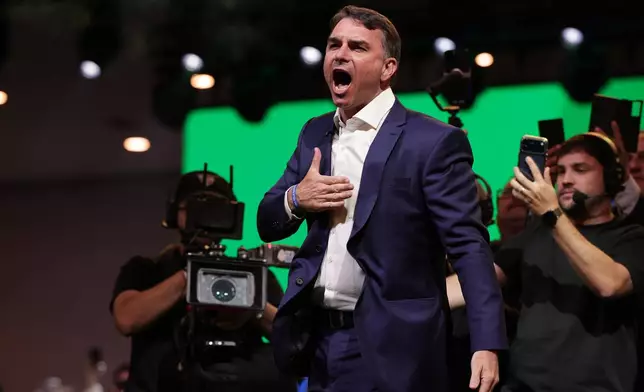 Brazilian Sen. Flavio Bolsonaro, the son of former President Jair Bolsonaro, arrives to the Liberal Party convention where he was confirmed as the party's presidential candidate, in Sao Paulo, Saturday, July 25, 2026. (AP Photo/Ettore Chiereguini)