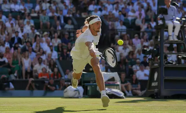 Alexander Zverev of Germany hits a return to Jannik Sinner of Italy during the men's singles final at Wimbledon Tennis Championships in London, Sunday, July 12, 2026. (AP Photo/Kin Cheung)