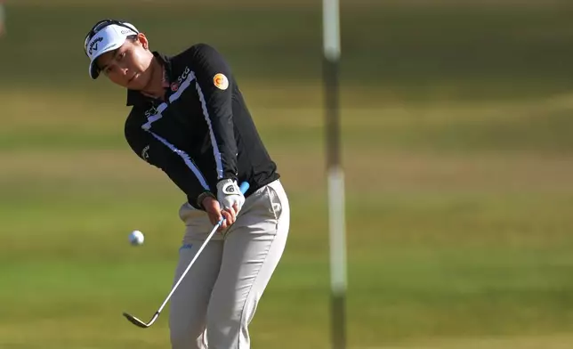 Jeeno Thitikul, of Thailand, chips onto the 14th green during the first round of the Women's British Open golf championship in Lytham St Annes, England, Thursday, July 30, 2026. (AP Photo/Jon Super)