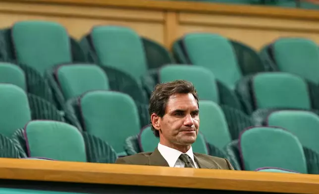 Former tennis player Roger Federer sits in the Royal box to watch the men's singles fourth round match between Alexander Zverev of Germany and Jiri Lehecka of the Czech Republic at the Wimbledon Tennis Championships in London, Monday, July 6, 2026.(AP Photo/Kirsty Wigglesworth)
