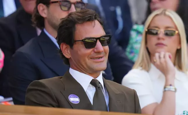 Former tennis player Roger Federer of Switzerland sits in the Royal Box on day eight at the Wimbledon Tennis Championships in London, Monday, July 6, 2026.(AP Photo/Kirsty Wigglesworth)