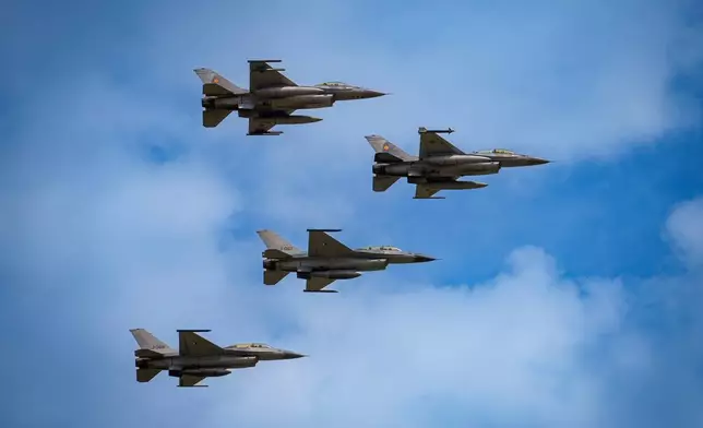 FILE - F16 fighter jets of the Romanian Air Force and the Romania based European F-16 Training Center (EFTC), perform a fly-by at the Black Sea, Defense, Aerospace and Security (BSDA) international exhibition in Bucharest, Romania, Wednesday, May 22, 2024. (AP Photo/Vadim Ghirda, File)