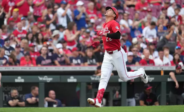 Cincinnati Reds' JJ Bleday celebrates a solo home run as he approaches home plate during the first inning in the second baseball game of a doubleheader against the Cleveland Guardians, Tuesday, July 28, 2026, in Cincinnati. (AP Photo/Kareem Elgazzar)