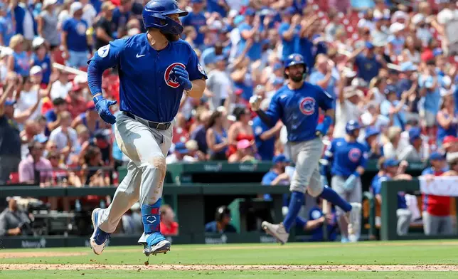 Chicago Cubs' Michael Busch runs up the baseline after hitting an RBI single during the seventh inning of a baseball game against the St. Louis Cardinals, Thursday, July 30, 2026, in St. Louis. (AP Photo/Scott Kane)