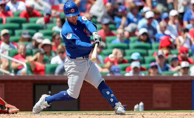 Chicago Cubs' Alex Bregman hits a double during the fourth inning of a baseball game against the St. Louis Cardinals, Thursday, July 30, 2026, in St. Louis. (AP Photo/Scott Kane)