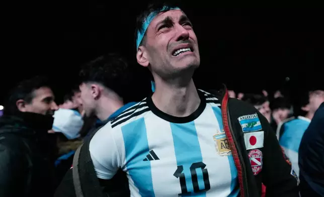 A fan reacts to Spain's victory over Argentina in the World Cup final soccer match at a fan gathering in Buenos Aires, Argentina, Sunday, July 19, 2026. (AP Photo/Gustavo Garello)