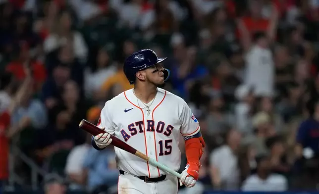 Houston Astros' Isaac Paredes watches his three-run home run during the fifth inning of a baseball game against the Miami Marlins, Tuesday, July 21, 2026, in Houston. (AP Photo/Kevin M. Cox)